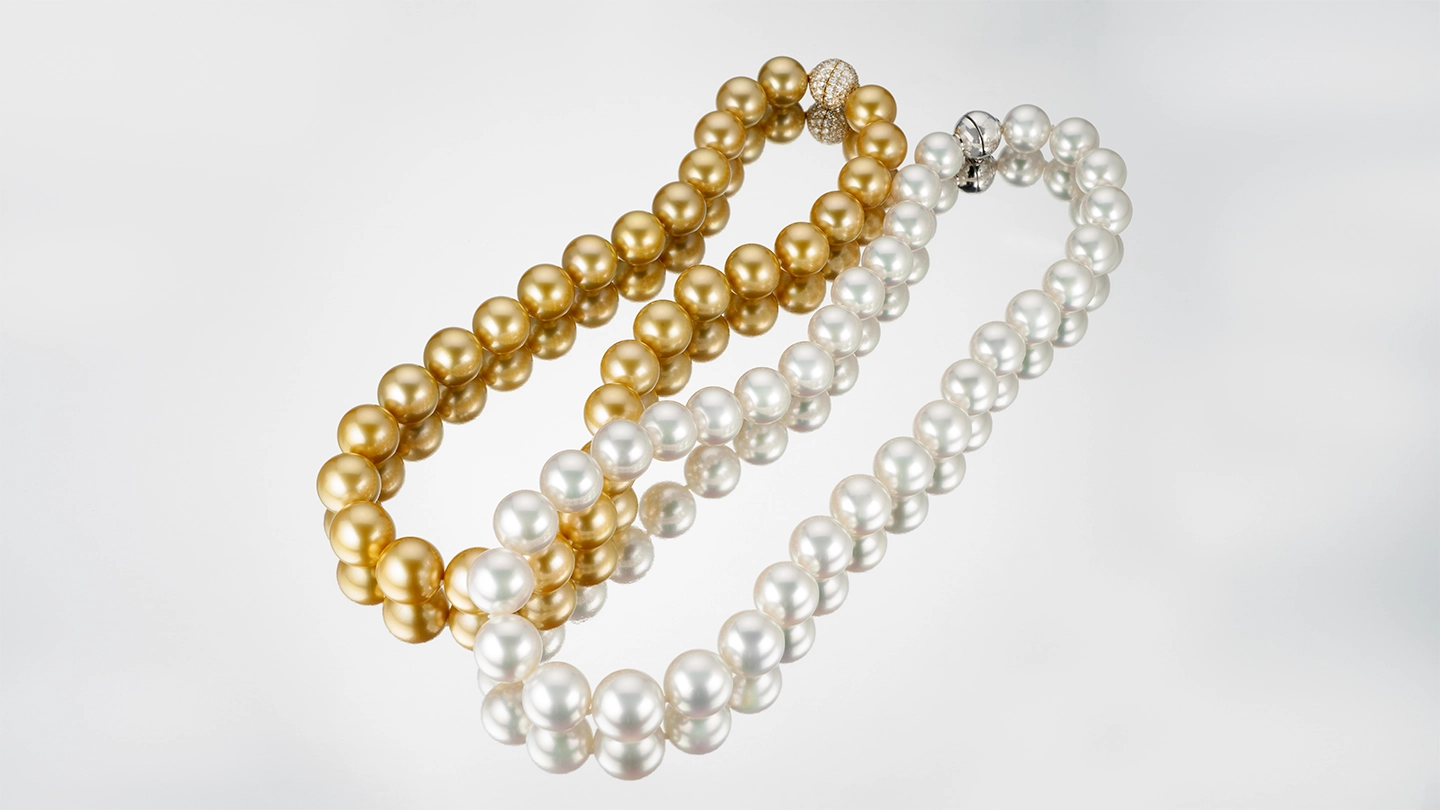 Two South Sea pearl strands, one white and one golden Two South Sea pearl strands, one white and one golden