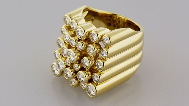 This 18K yellow gold ring ¬won the De Beers Diamond International Awards in 1966. It features 28 round brilliant cut diamonds with total carat weight of 2.66 carats. Photo by Don Mengason/GIA, gift of Amsterdam Sauer This 18K yellow gold ring ¬won the De Beers Diamond International Awards in 1966. It features 28 round brilliant cut diamonds with total carat weight of 2.66 carats. Photo by Don Mengason/GIA, gift of Amsterdam Sauer