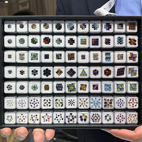Figure 8. Precision-cut, calibrated gems in a variety of shapes ranging from 1.0 × 1.5 mm baguettes to 4.0 × 6.0 mm lozenges, including amethyst, citrine, tourmaline, topaz, garnet, and peridot, arranged to illustrate various color combinations and patterns. Photo by Jennifer Stone-Sundberg; courtesy of Shanu G. Inc. Figure 8. Precision-cut, calibrated gems in a variety of shapes ranging from 1.0 × 1.5 mm baguettes to 4.0 × 6.0 mm lozenges, including amethyst, citrine, tourmaline, topaz, garnet, and peridot, arranged to illustrate various color combinations and patterns. Photo by Jennifer Stone-Sundberg; courtesy of Shanu G. Inc.