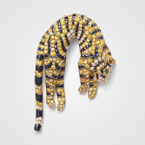 Figure 5. “Tiger” clip brooch, Cartier Paris, 1957. Single- and brilliant-cut diamonds ranging from colorless to various hues of yellow, set with marquise-shaped emeralds (eyes) and onyx (stripes) in gold. Courtesy of the Cartier collection. Figure 5. “Tiger” clip brooch, Cartier Paris, 1957. Single- and brilliant-cut diamonds ranging from colorless to various hues of yellow, set with marquise-shaped emeralds (eyes) and onyx (stripes) in gold. Courtesy of the Cartier collection.