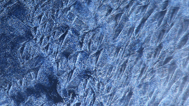 A unique pattern of particles in a Sri Lankan blue sapphire is observed under fiber-optic illumination. Photomicrograph by Titapa Tanawansombat; field of view 1.80 mm. A unique pattern of particles in a Sri Lankan blue sapphire is observed under fiber-optic illumination. Photomicrograph by Titapa Tanawansombat; field of view 1.80 mm.