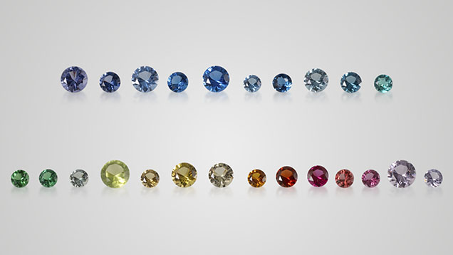 Figure 1. Glass-ceramics can be created in a full spectrum of colors to imitate a wide range of natural gemstones. Shown here are transparent samples (0.10–0.37 ct) donated for this study by the Formica Group, from left to right: GC-01 to GC-10 (top row) and GC-11 to GC-24 (bottom row). Photo by Nuttapol Kitdee.