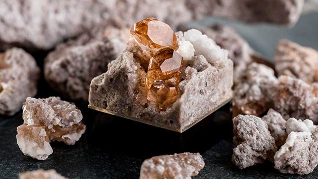 Figure 3. Topaz in matrix keycap with an inlaid base of sterling silver. Courtesy of Carter Stay, Keycap Quarry. Figure 3. Topaz in matrix keycap with an inlaid base of sterling silver. Courtesy of Carter Stay, Keycap Quarry.