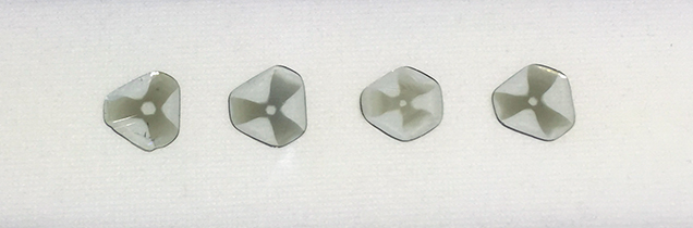 Diamond slices showing a “trapiche” pattern. Diamond slices showing a “trapiche” pattern.