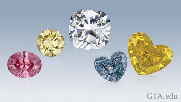 A pink round diamond, a yellow round diamond, a colorless cushion cut diamond, a blue heart shape diamond and a yellow heart shape diamond. A pink round diamond, a yellow round diamond, a colorless cushion cut diamond, a blue heart shape diamond and a yellow heart shape diamond.