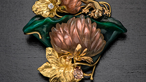 Pin/pendant with sunstone, pearl, diamond, chalcedony, and zircon.