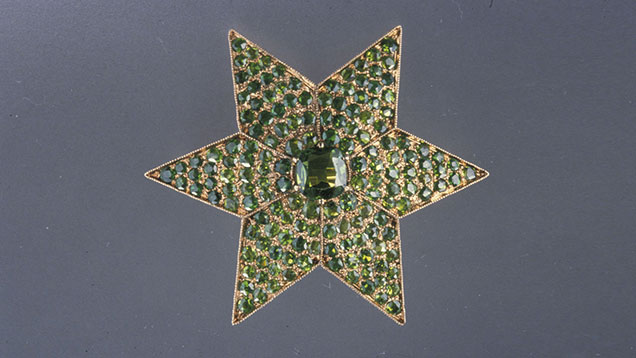 Demantoid garnets provide a field of green for this antique star brooch manufactured in Russia. Demantoid garnets were popular in Russian jewelry from 1875 to 1920. Courtesy of A La Vielle Russie, New York City; photo by Nicholas Del Re © GIA Demantoid garnets provide a field of green for this antique star brooch manufactured in Russia. Demantoid garnets were popular in Russian jewelry from 1875 to 1920. Courtesy of A La Vielle Russie, New York City; photo by Nicholas Del Re © GIA