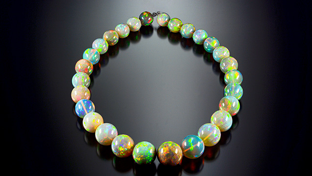 Opal strand exhibiting vibrant play-of-color. Opal strand exhibiting vibrant play-of-color.