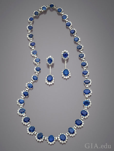 The sapphires in this necklace and earring set all framed with diamonds. The sapphires in this necklace and earring set all framed with diamonds.