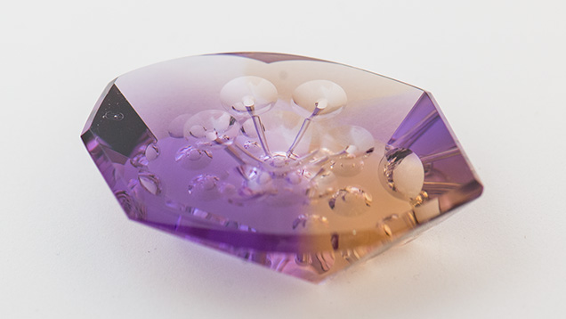 Many consumers value unusual gems cut in unique designs. This intriguing 26.60-ct. ametrine was fashioned by gem artist Michael Dyber. It’s meant to grace a one-of-a-kind jewelry piece. – Eric Welch, courtesy Michael Dyber Many consumers value unusual gems cut in unique designs. This intriguing 26.60-ct. ametrine was fashioned by gem artist Michael Dyber. It’s meant to grace a one-of-a-kind jewelry piece. – Eric Welch, courtesy Michael Dyber