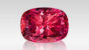 Figure 1. Ben Kho fashioned this 12.88 ct Portuguese cushion-cut rhodochrosite from Colorado’s Sweet Home mine to win both the 2024 AGTA Cutting Edge Buyer’s Choice Award and second place in the North American Gemstones category. Photo by Jeff Mason Photography; courtesy of Ben Kho. Figure 1. Ben Kho fashioned this 12.88 ct Portuguese cushion-cut rhodochrosite from Colorado’s Sweet Home mine to win both the 2024 AGTA Cutting Edge Buyer’s Choice Award and second place in the North American Gemstones category. Photo by Jeff Mason Photography; courtesy of Ben Kho.