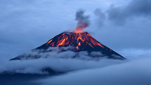 Figure 2. Eruption of the Tungurahua volcano in Ecuador. Various gem minerals can crystallize from molten magmas in the earth’s crust or when the magmas erupt at the surface. Magmas also bring up pieces of mantle or crustal rocks called <em>xenoliths</em> that are of great value for scientific study. Courtesy of Sebastián Crespo Photography/Moment/Getty Images. Figure 2. Eruption of the Tungurahua volcano in Ecuador. Various gem minerals can crystallize from molten magmas in the earth’s crust or when the magmas erupt at the surface. Magmas also bring up pieces of mantle or crustal rocks called <em>xenoliths</em> that are of great value for scientific study. Courtesy of Sebastián Crespo Photography/Moment/Getty Images.