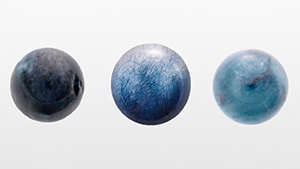 Figure 1. Three quartz spheres weighing 4.85, 5.50, and 5.40 ct, respectively, colored by blue needle-like inclusions. Photo by Rong Liang. Figure 1. Three quartz spheres weighing 4.85, 5.50, and 5.40 ct, respectively, colored by blue needle-like inclusions. Photo by Rong Liang.