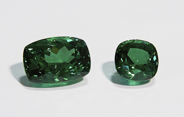 Cushion-cut and square cushion-cut tsavorites. Cushion-cut and square cushion-cut tsavorites.