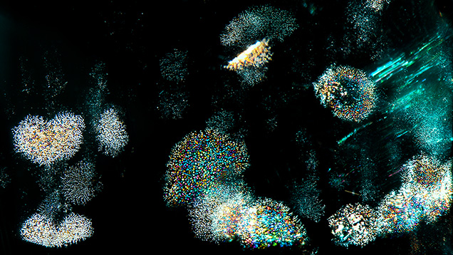 Interference thin films in Russian emerald resembling a sky filled with fireworks. Photomicrograph by Ungkhana Atikarnsakul; field of view 3.60 mm. Interference thin films in Russian emerald resembling a sky filled with fireworks. Photomicrograph by Ungkhana Atikarnsakul; field of view 3.60 mm.