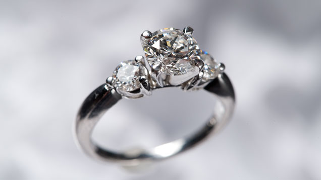 Three stone diamond and platinum ring. 