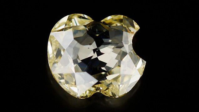 Fancy yellow diamond cut to resemble the Apple logo. Fancy yellow diamond cut to resemble the Apple logo.