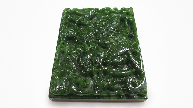 Jadeite jade and serpentine doublet carving.
