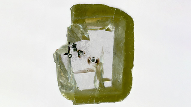 LA-ICP-MS analysis spots on the polished diamond slab containing davemaoite. LA-ICP-MS analysis spots on the polished diamond slab containing davemaoite.