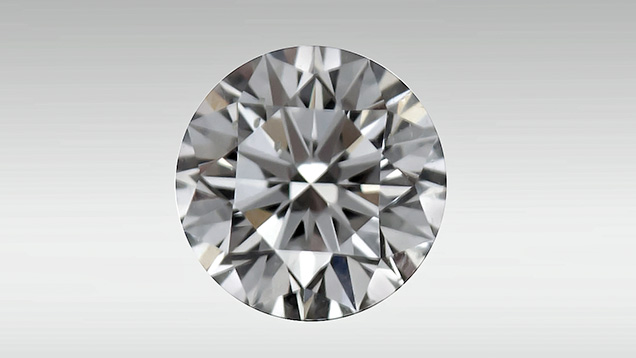 Round brilliant diamond showing bright red fluorescence.