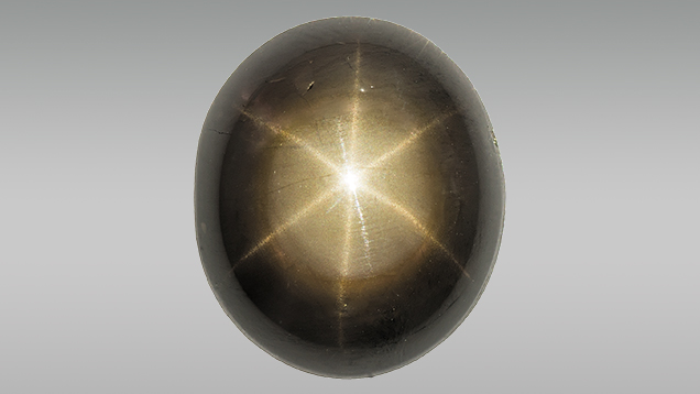 Black star sapphire enhanced with lead glass Black star sapphire enhanced with lead glass