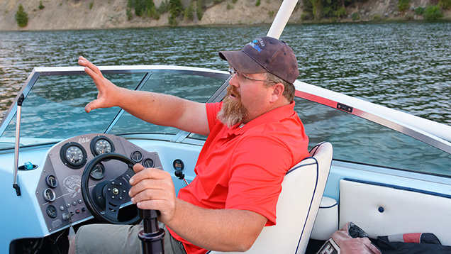 Man on boat talking Man on boat talking