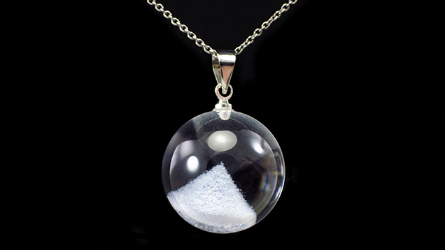 Three-dimensional laser engraving in a natural quartz pendant.