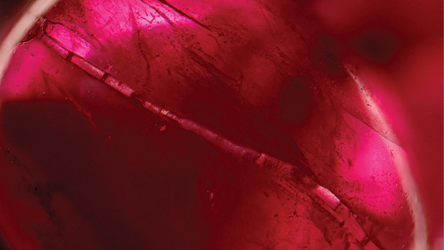 Highly fractured and filled ruby beads