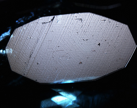 Some of the circuit board pattern runs parallel to the polish lines.