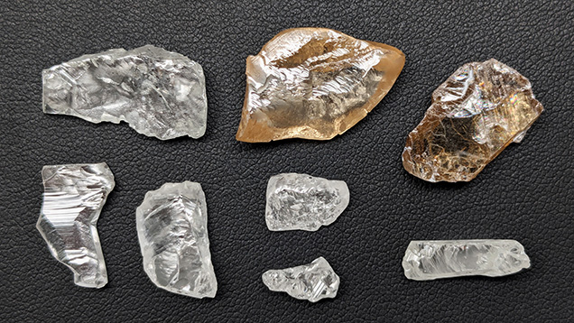 Figure 8. Superdeep diamonds, ranging from 1.27 to 12.97 ct, with typical irregular sculpted shapes resulting from extensive breakage and resorption. The top left specimen is 21 mm in length. Photo by Evan M. Smith.