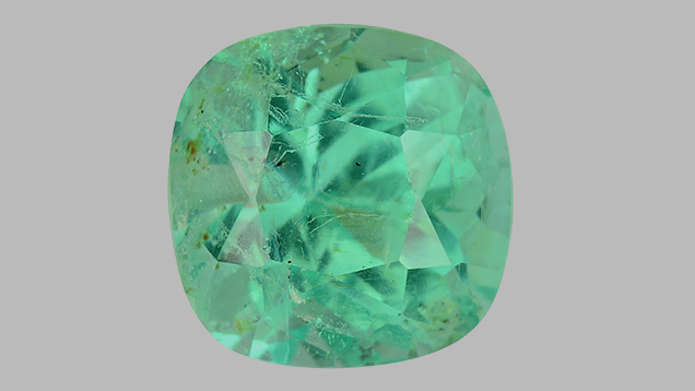 Emerald with two drill holes