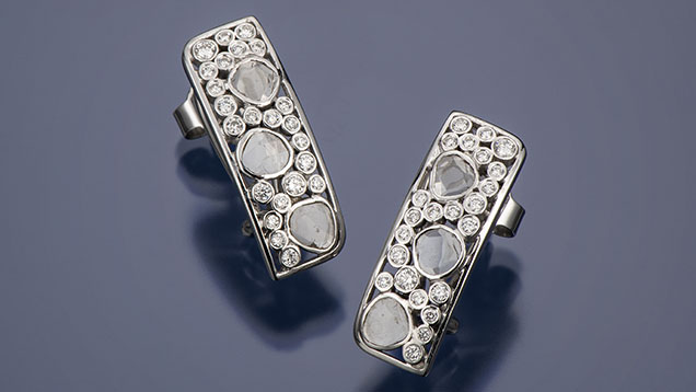 Figure 2. “Rose Cut” 18K white gold and diamond earrings. The faceted diamonds are 1.5–2.0 mm in diameter. Photo by Robert Weldon; courtesy of Sean Hill Designs. Figure 2. “Rose Cut” 18K white gold and diamond earrings. The faceted diamonds are 1.5–2.0 mm in diameter. Photo by Robert Weldon; courtesy of Sean Hill Designs.