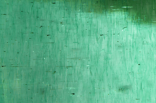 Green dye seen in evenly distributed concentrations.