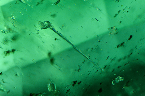 A nail-head spicule found in a natural Russian emerald. A nail-head spicule found in a natural Russian emerald.