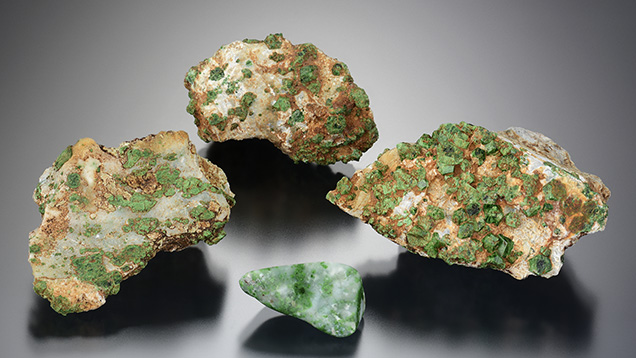 Green uvarovite garnets in white prehnite matrix.