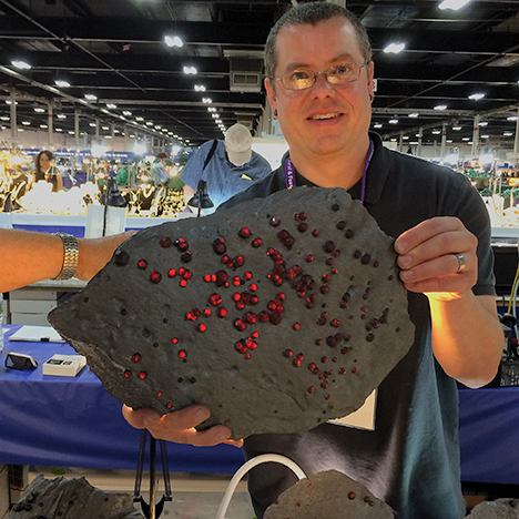 Jason Baskin with almandine in graphite schist.