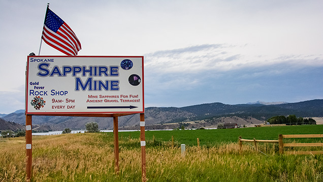 Spokane Sapphire Mine sign and flag in field Spokane Sapphire Mine sign and flag in field