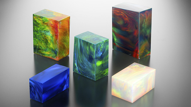 Imitation opal blocks display play-of-color phenomenon.