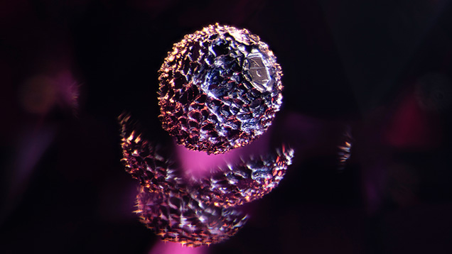 An opaque crystal, likely a metal sulfide, is suspended in a garnet. A combination of darkfield and oblique fiber-optic illumination makes it appear as though the crystal is hovering inside the stone. Portions of the inclusion are duplicated because of its split across several facet junctions, adding to the visual interest. Photomicrograph by E. Billie Hughes; field of view 4 mm.