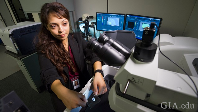 Young woman works with a Raman spectroscopy machine. Young woman works with a Raman spectroscopy machine.