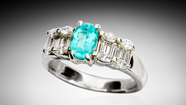 Paraíba tourmaline with coating. Paraíba tourmaline with coating.