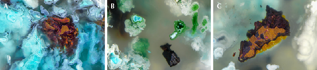 Figure 2. The Indonesian chalcedony contains vibrant inclusions such as greenish blue chrysocolla (A), green malachite, and well-formed crystals of native copper that has in some cases altered to the deep red mineral cuprite (A, B, and C). Photomicrographs by Nathan Renfro; fields of view 10.27 mm (A), 4.17 mm (B), and 4.77 mm (C).