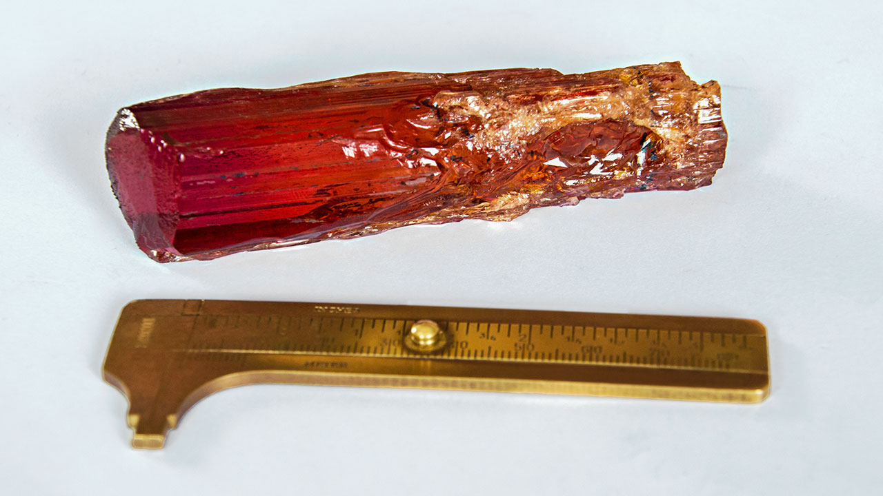 199079-1280x720.jpg. The brass gauge gives a good indication of the 615 ct topaz crystal’s dimensions. Photo courtesy Sonja Kreis Unique Jewelry.