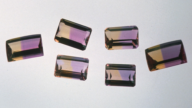 Emerald-cut Ametrines. Rectangular step cuts clearly show off the striking bicolor nature of these ametrines. Photo by Maha Tannous/GIA.