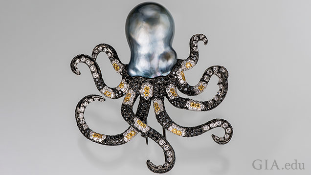 The octopus head is a baroque Tahitian cultured pearl and its arms are made of black, yellow and white diamond (in a striped pattern) set in black-plated 18K gold.
