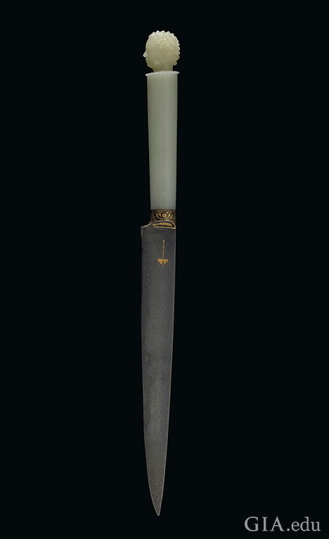 A white jadite dagger. A white jadite dagger.