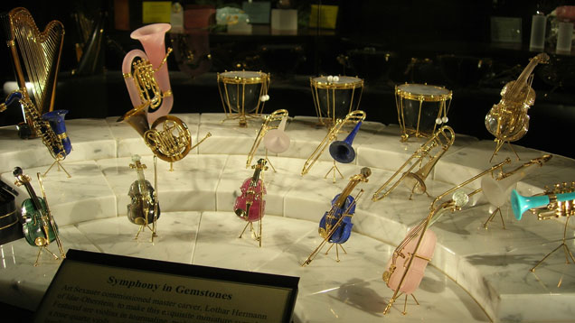 Art Sexauer commissioned master gem carver Lothar Hermann of Idar-Oberstein to create this exquisite collection of musical instruments in gem materials and 18K yellow gold.