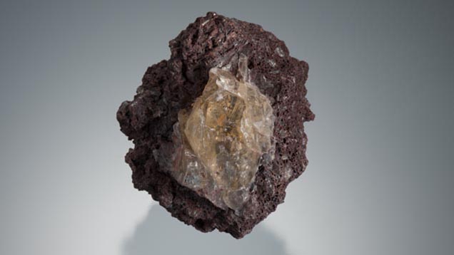 This large yellow feldspar phenocryst is embedded in a matrix of volcanic cinder. - Robert Weldon