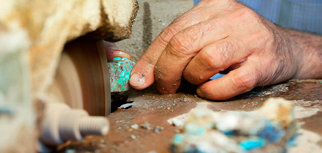 Lapidary slabbing rough Neyshabur turquoise in a workshop in Mashhad Lapidary slabbing rough Neyshabur turquoise in a workshop in Mashhad