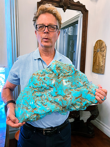 A massive resin imitation of turquoise held by Russell Twiford III. A massive resin imitation of turquoise held by Russell Twiford III.